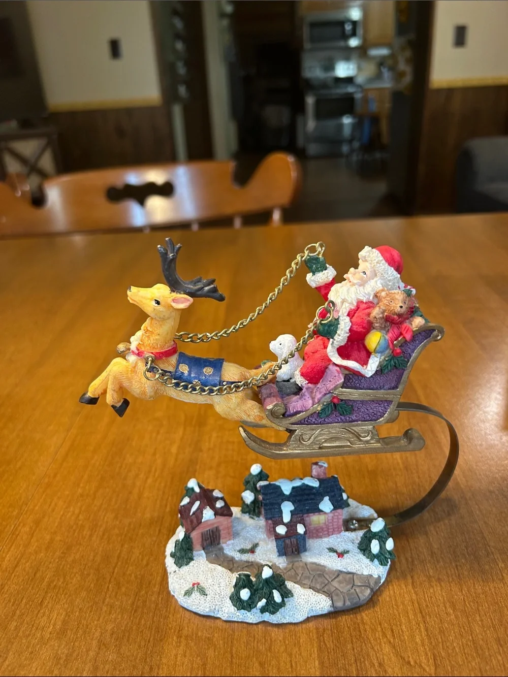 Festive Santa in Red Sleigh with Reindeer Holiday Figurine